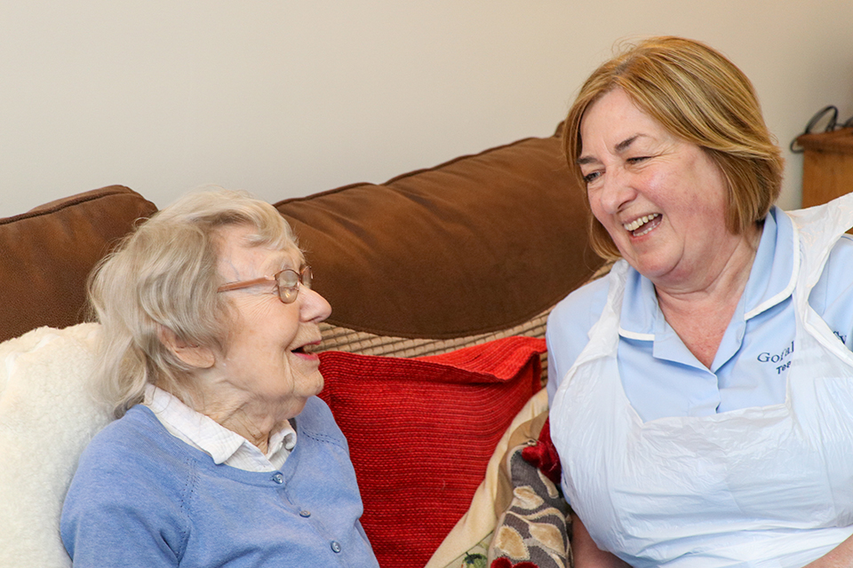 2 women laughing