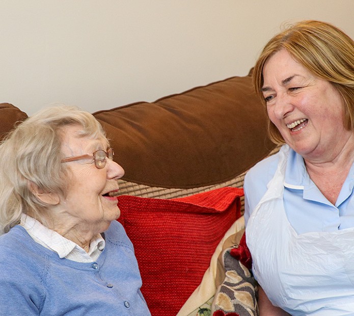 2 women laughing together