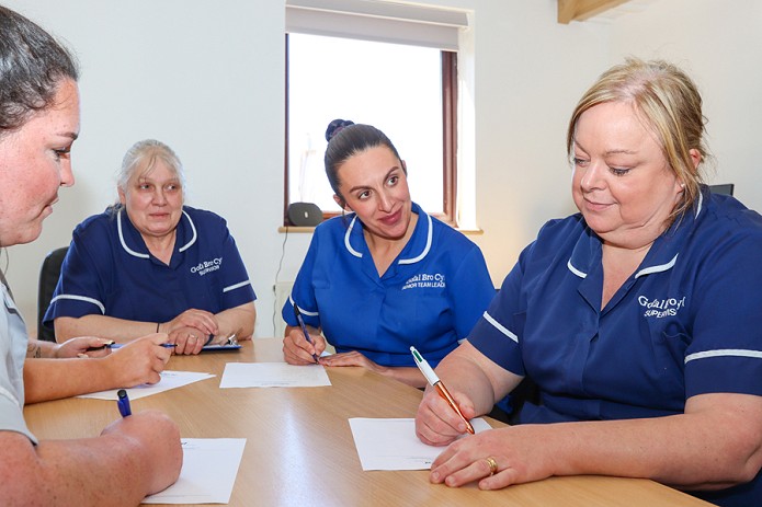 women around the table doing training